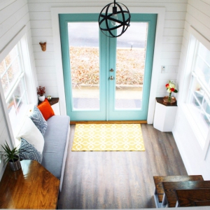 The Sprout from Mustard Seed Tiny Homes - living room view from loft
